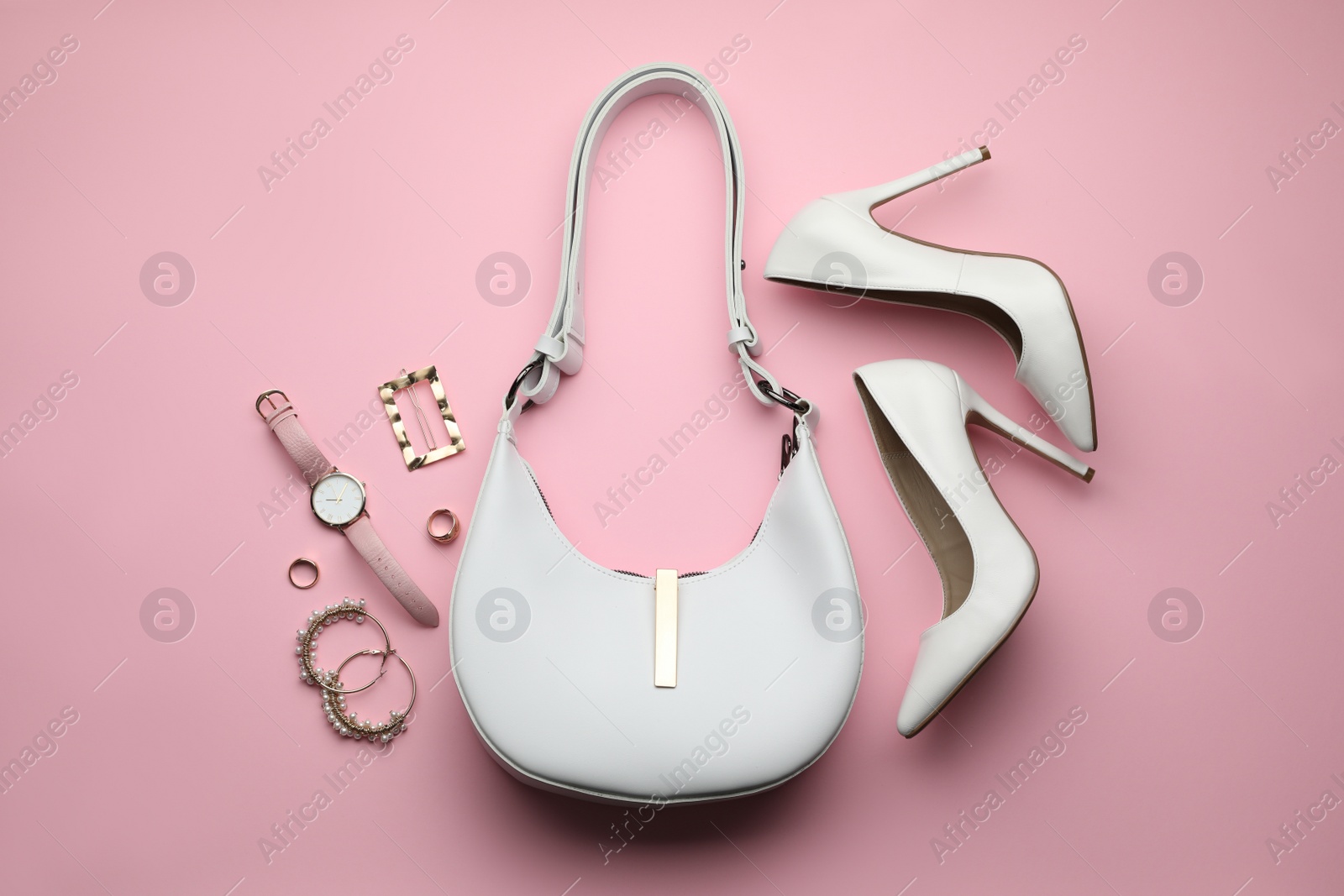 Photo of Stylish woman's bag, shoes and accessories on pink background, flat lay