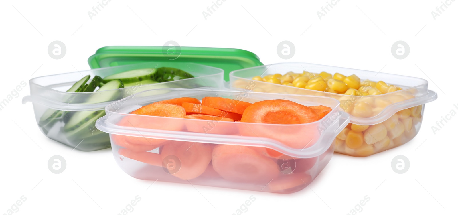 Photo of Fresh vegetables in plastic containers on white background
