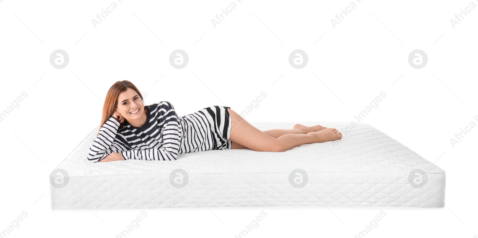 Photo of Woman lying on mattress against white background