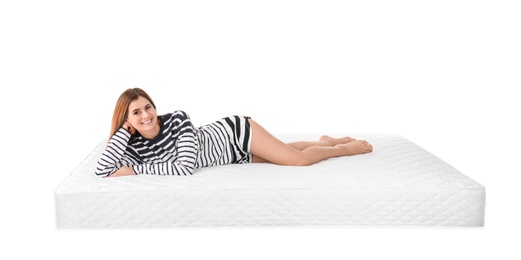 Photo of Woman lying on mattress against white background