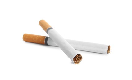 Photo of Cigarettes with orange filters isolated on white