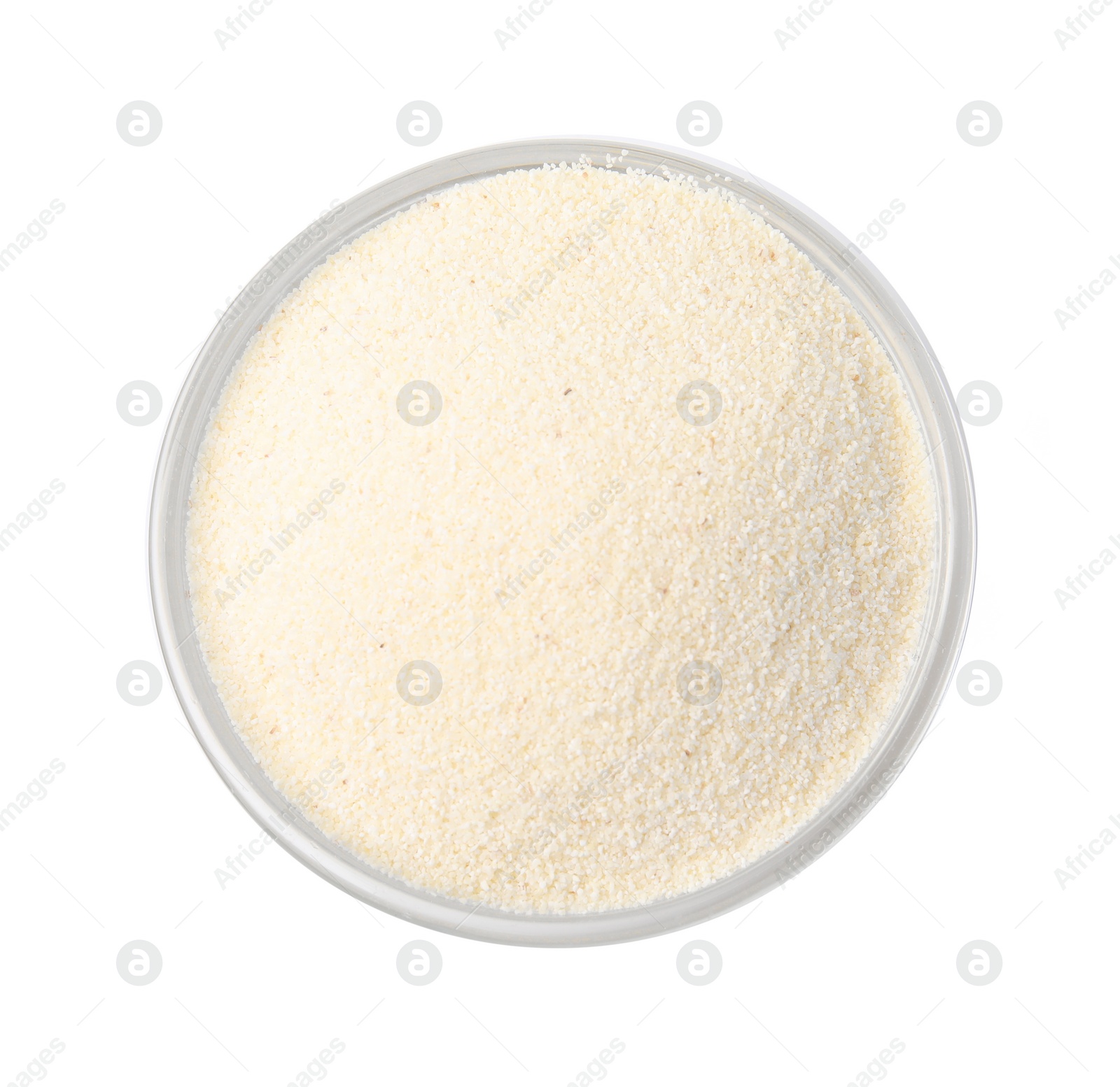 Photo of Bowl of uncooked organic semolina isolated on white, top view