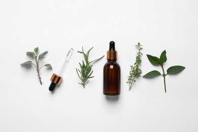 Photo of Bottle of essential oil, pipette and different herbs on white background, flat lay