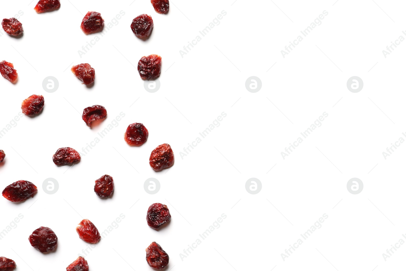 Photo of Flat lay composition of cranberries on white background, space for text. Dried fruit as healthy snack