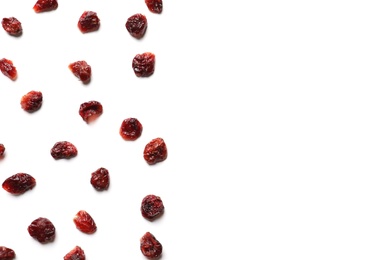 Photo of Flat lay composition of cranberries on white background, space for text. Dried fruit as healthy snack