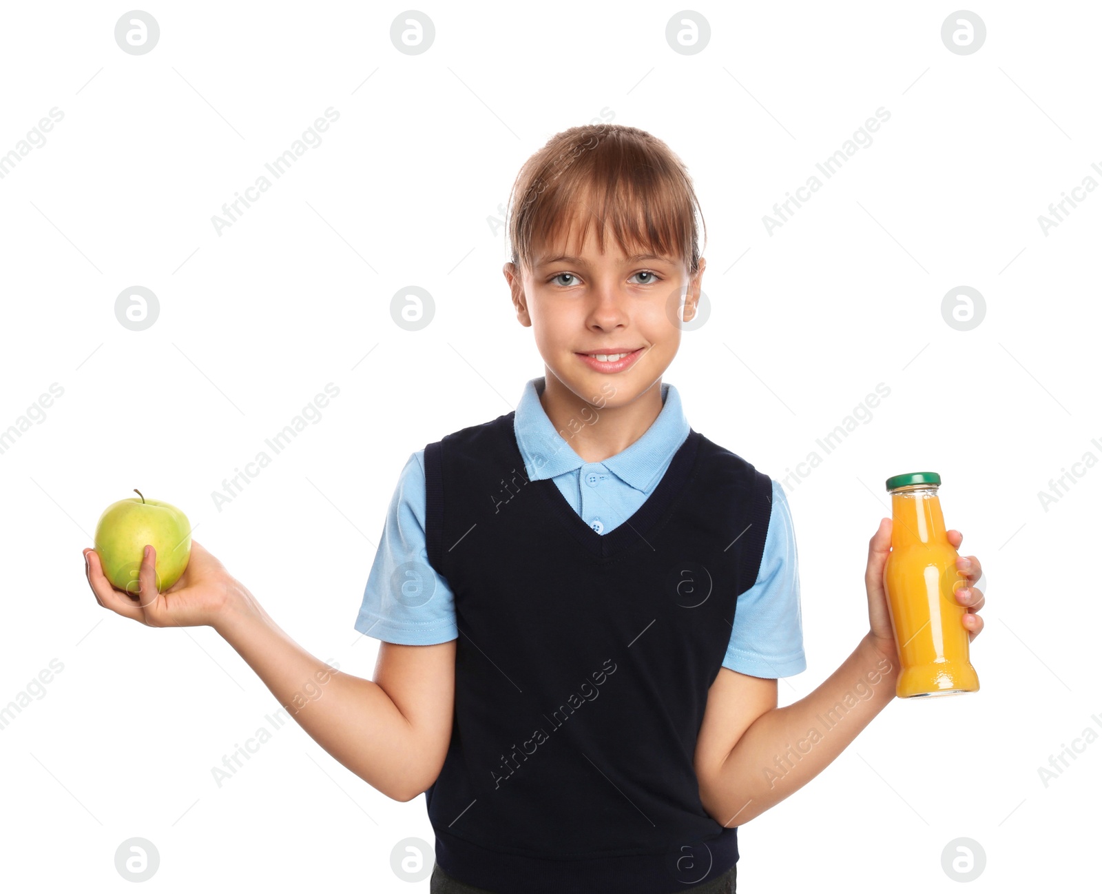 Photo of Little girl with bottle of juice and apple on white background. Healthy food for school lunch