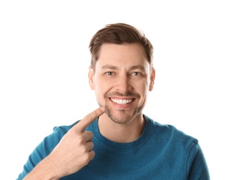 Photo of Smiling man with perfect teeth on white background