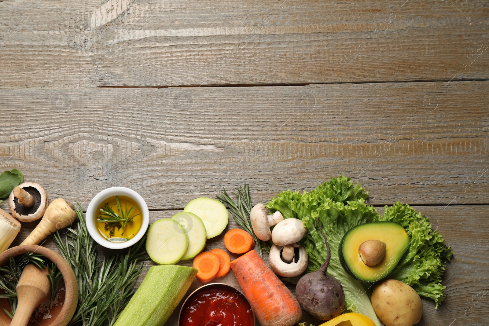 Photo of Flat lay composition with fresh products on wooden table, space for text. Healthy cooking