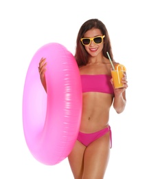 Beautiful young woman with inflatable ring and glass of cocktail on white background