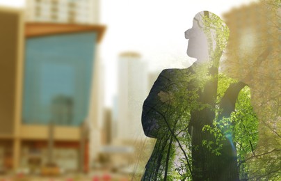 Image of Double exposure of man and green trees in city