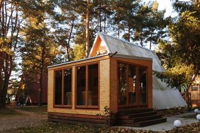 Picturesque view of modern wooden house in forest