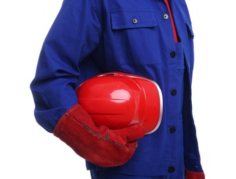 Young man holding red hardhat on white background, closeup. Safety equipment