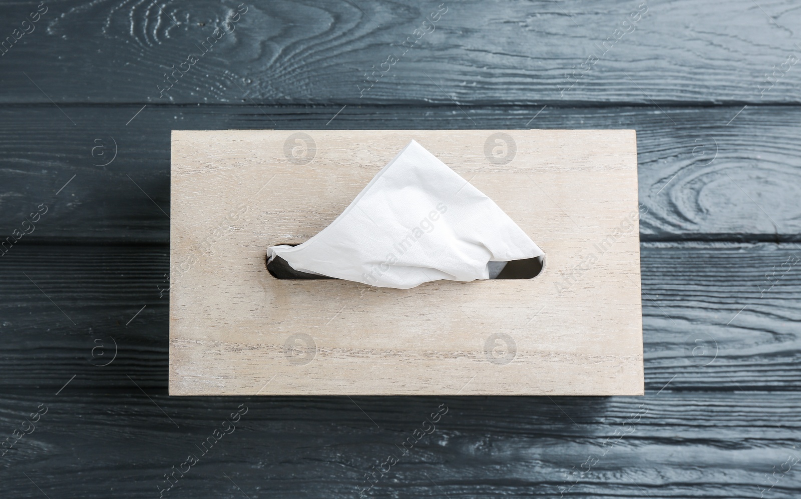 Photo of Box of tissues on grey wooden table, top view