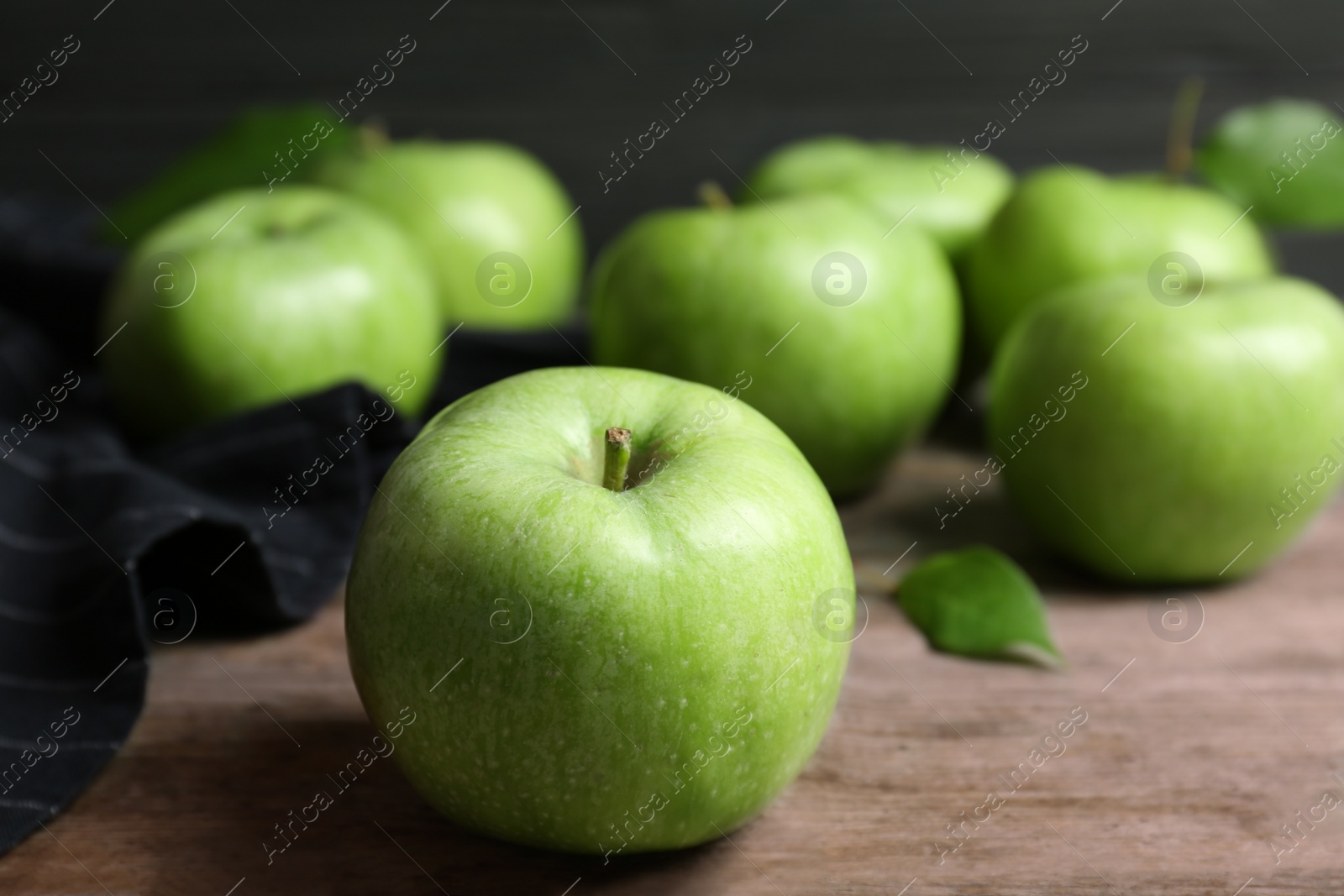 Photo of Fresh green apples on wooden table