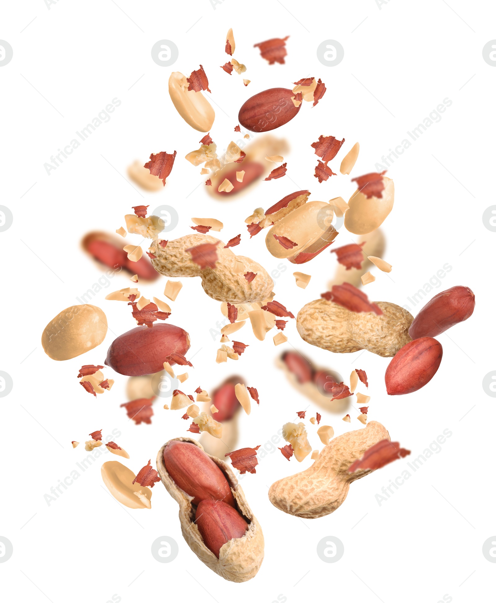 Image of Unpeeled peanuts in air on white background