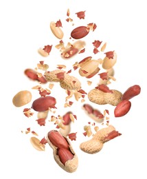 Image of Unpeeled peanuts in air on white background