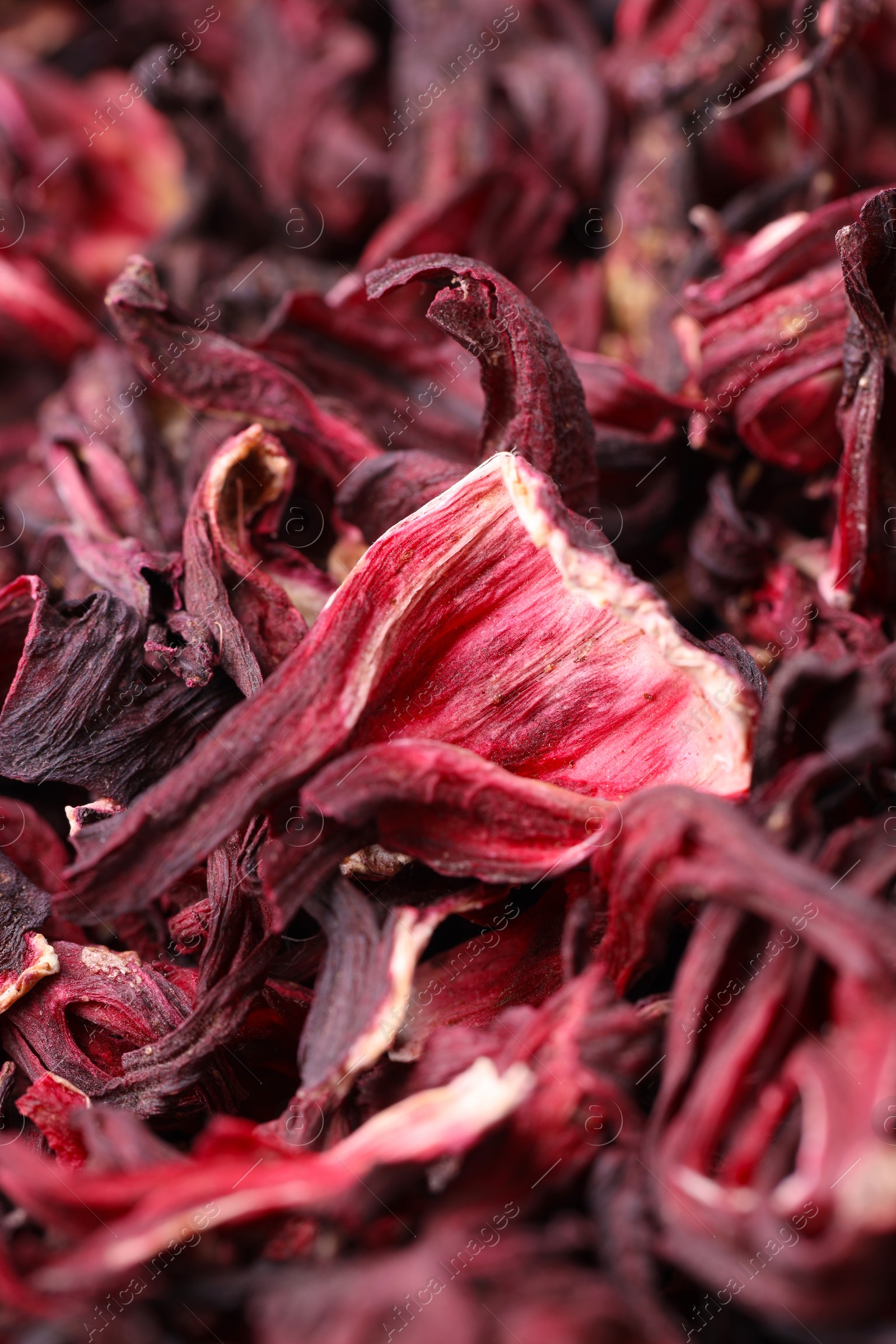 Photo of Dry hibiscus tea as background, closeup view