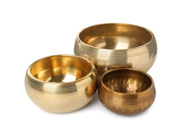 Three Tibetan singing bowls on white background