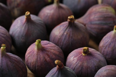 Tasty fresh figs as background, closeup view