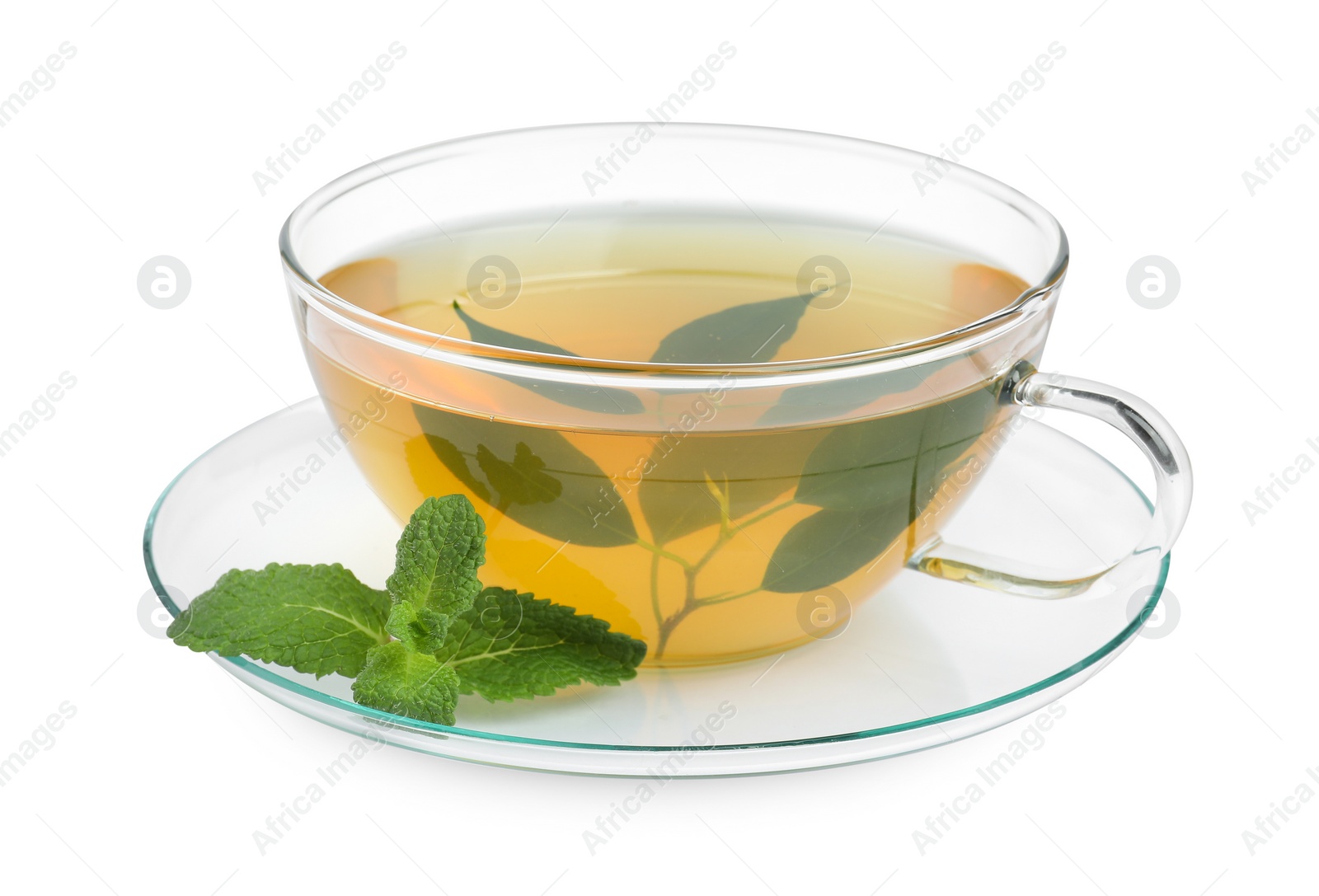 Photo of Fresh green tea in glass cup, mint and saucer isolated on white