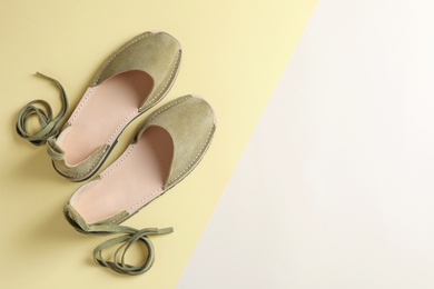 Photo of Pair of trendy women's shoes on color background