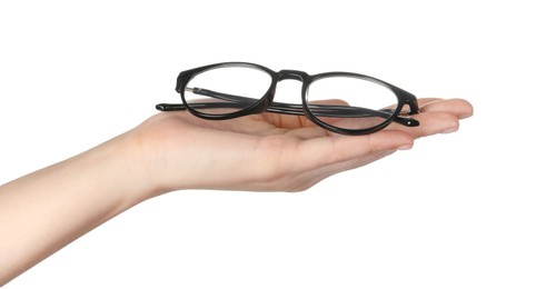 Photo of Woman holding glasses with black frame on white background, closeup