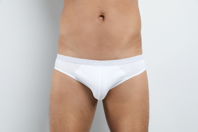 Photo of Man in underwear on white background, closeup