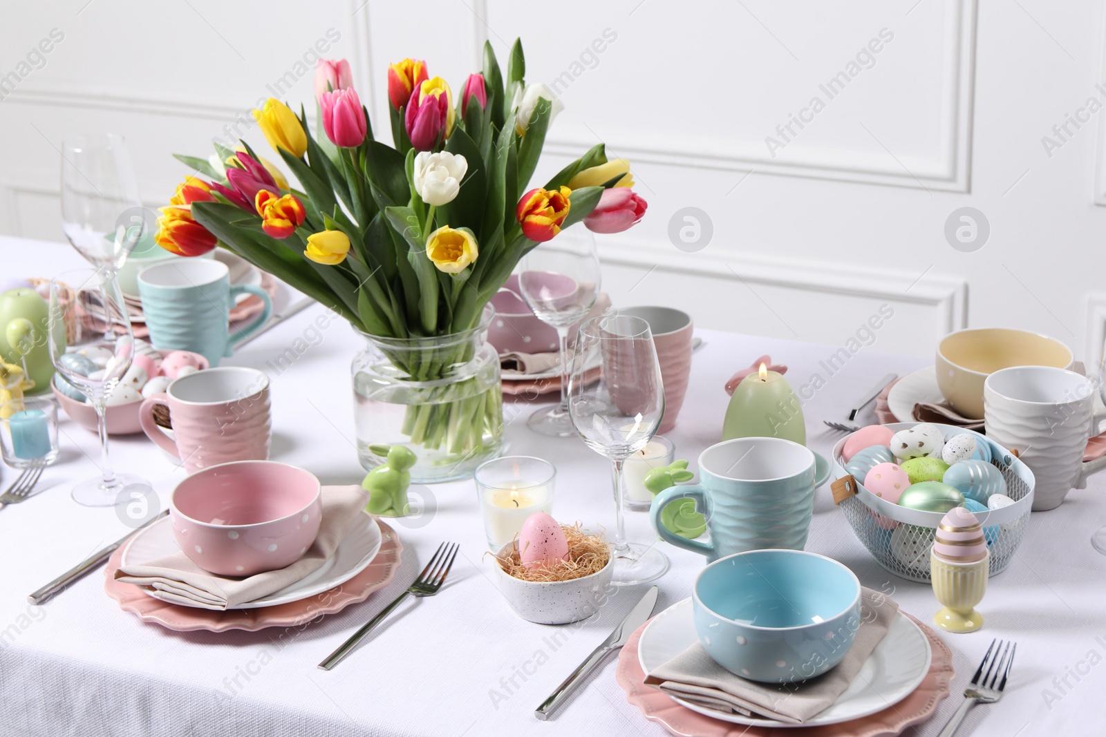 Photo of Festive table setting with beautiful flowers. Easter celebration