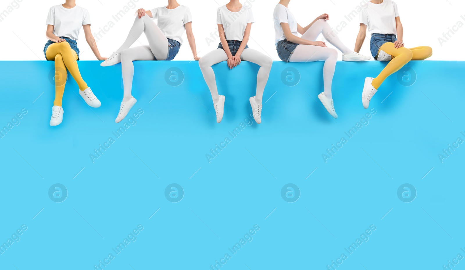 Image of Women wearing different tights and stylish shoes sitting on color background, closeup 