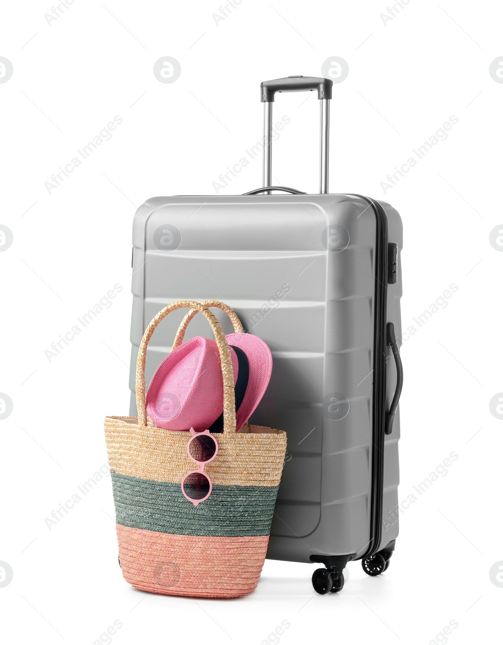 Photo of Gray suitcase and bag packed for journey on white background