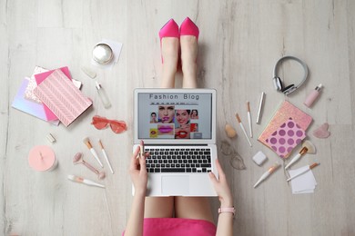Photo of Fashion blogger with laptop on floor, top view