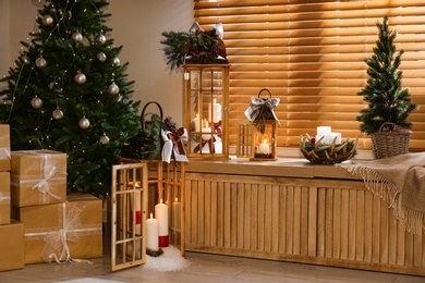 Beautiful wooden Christmas lanterns in decorated room