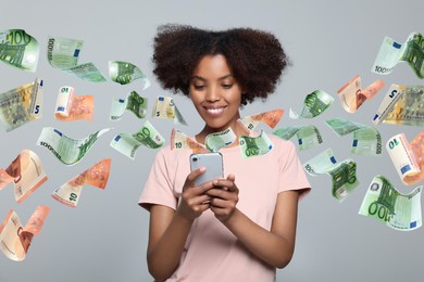 Image of Online payment. Woman buying something using mobile phone on light grey background. Euro banknotes flying out of gadget demonstrating process of money transaction