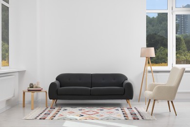 Photo of Living room with beautiful carpet and furniture