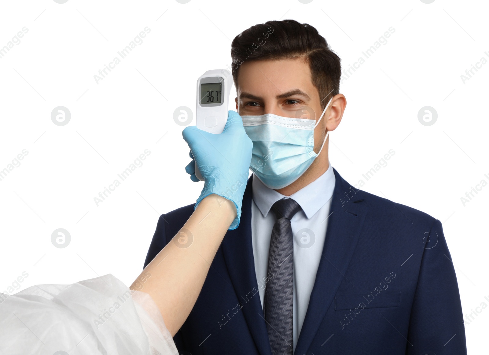 Photo of Doctor measuring man's temperature on white background, closeup. Prevent spreading of Covid-19