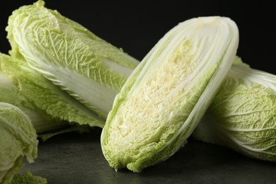 Fresh ripe Chinese cabbages on grey table