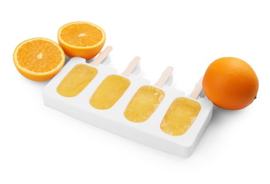 Photo of Tasty orange ice pops in mold isolated on white. Fruit popsicle