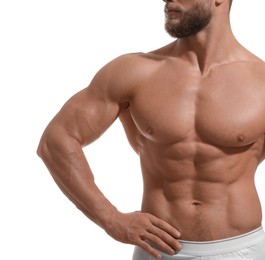 Photo of Muscular man showing abs isolated on white, closeup. Sexy body