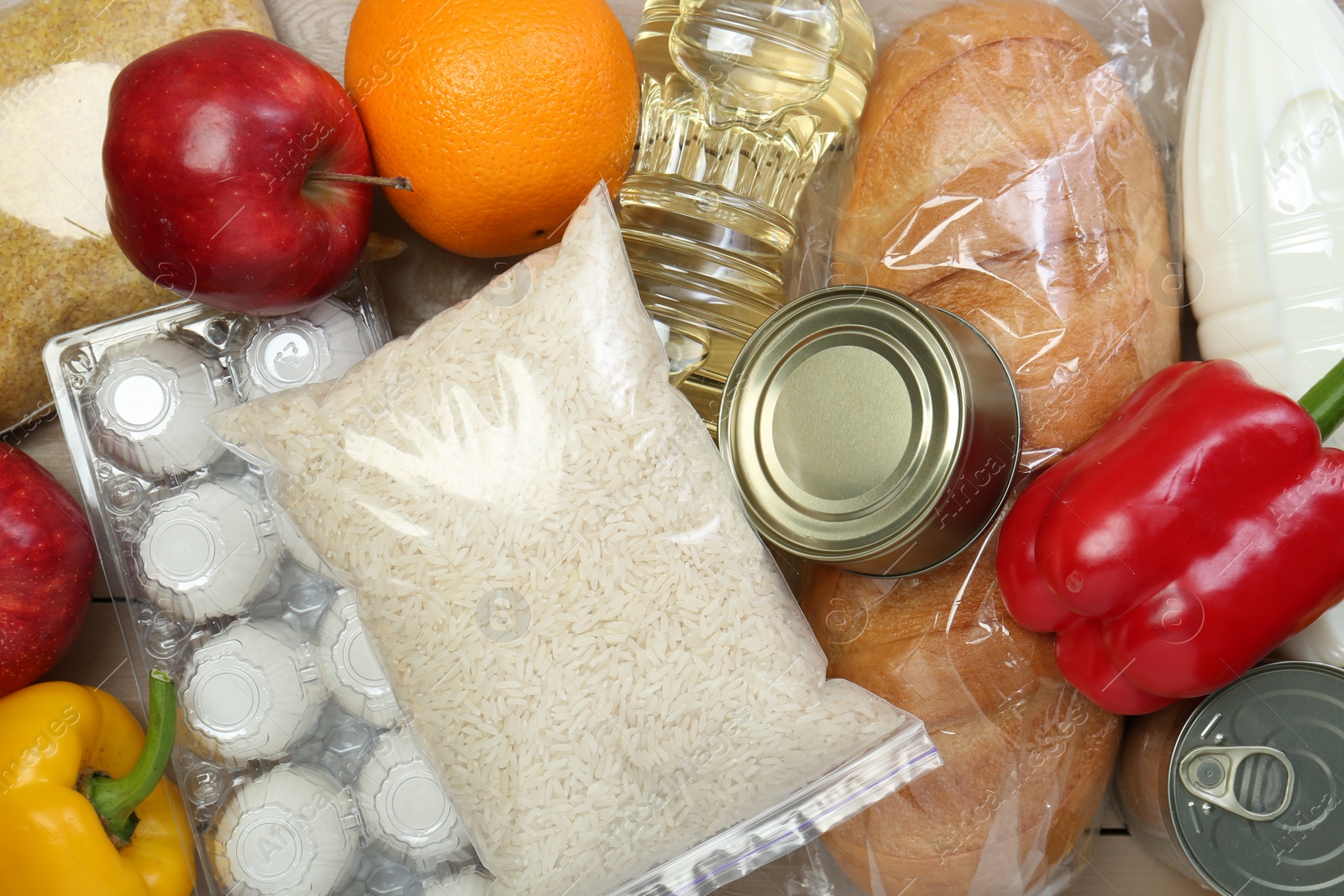 Photo of Different donation food on table, flat lay