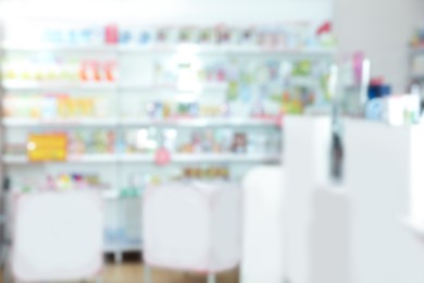 Image of Pharmacy interior with different pharmaceuticals, blurred view