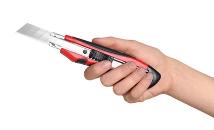 Photo of Woman holding utility knife on white background, closeup