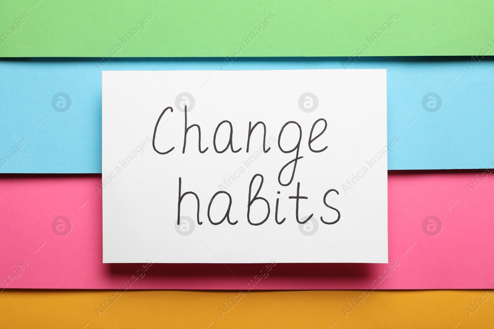 Photo of Paper note with phrase Change Habits on color background, top view