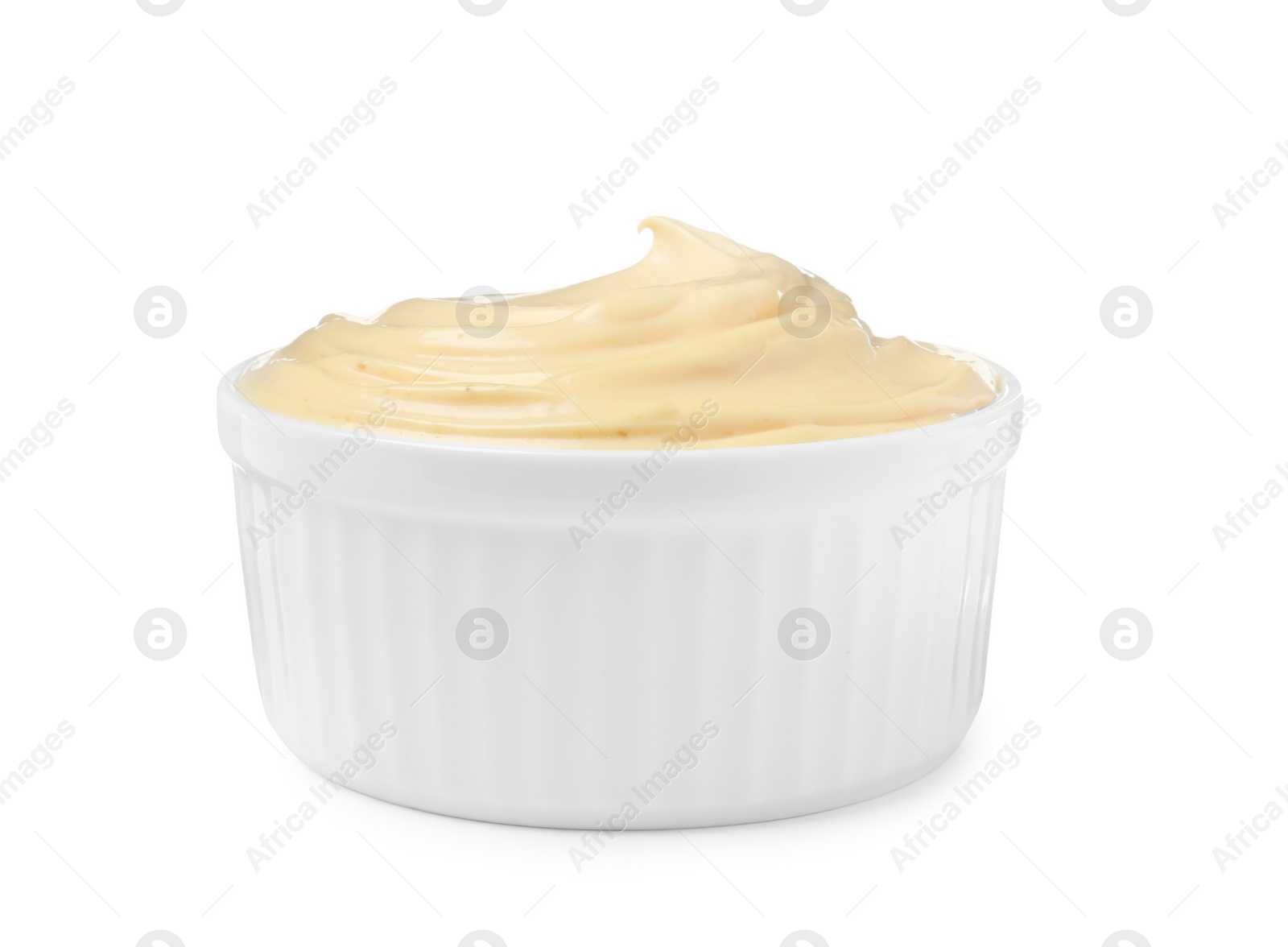 Photo of Tasty cheese sauce in bowl isolated on white