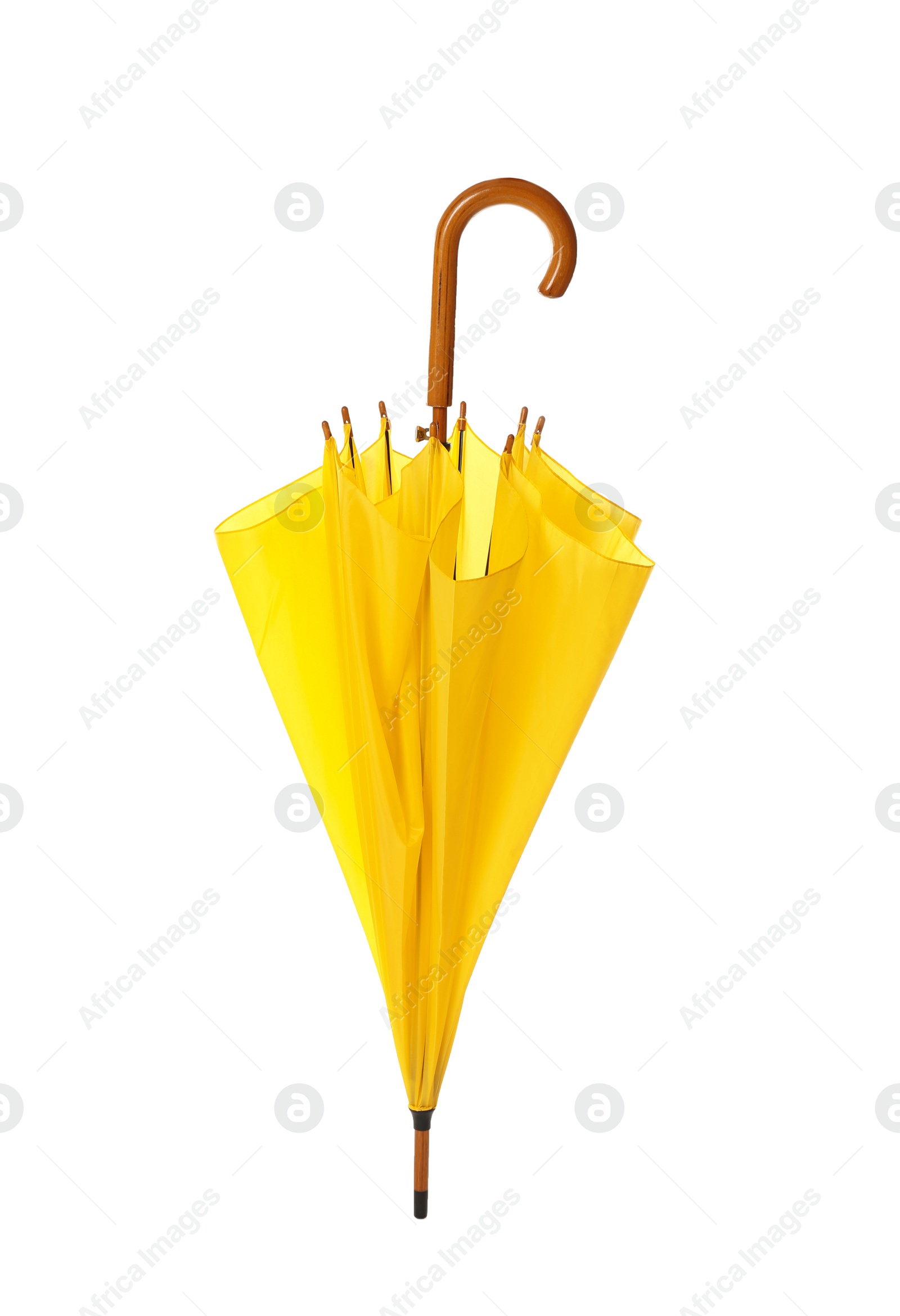 Photo of Modern closed yellow umbrella isolated on white