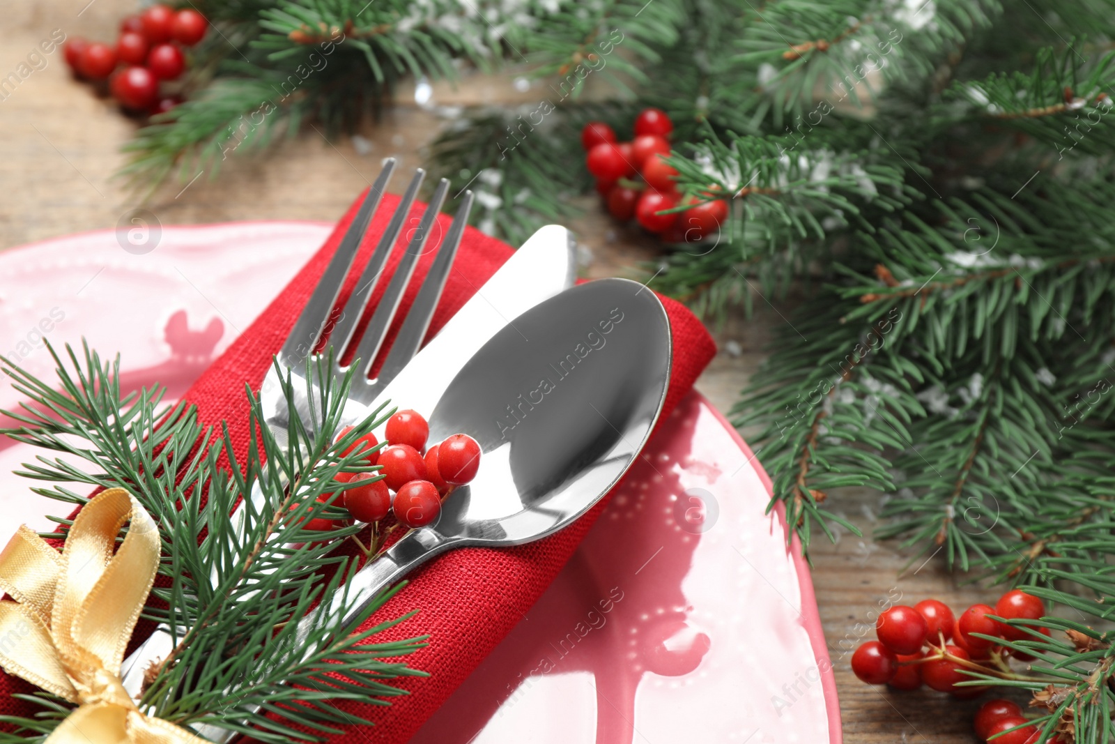 Photo of Christmas table setting on wooden background, closeup