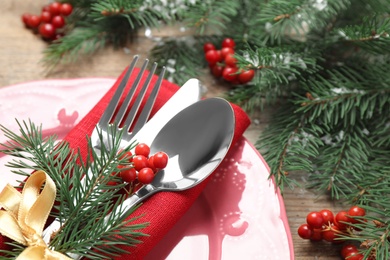 Photo of Christmas table setting on wooden background, closeup