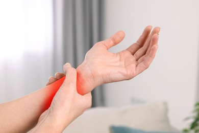 Image of Woman suffering from rheumatism at home, closeup