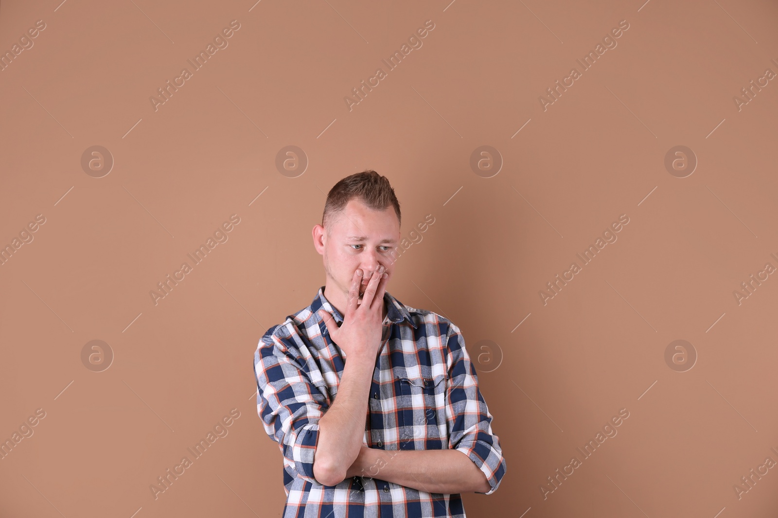 Photo of Portrait of handsome man on color background