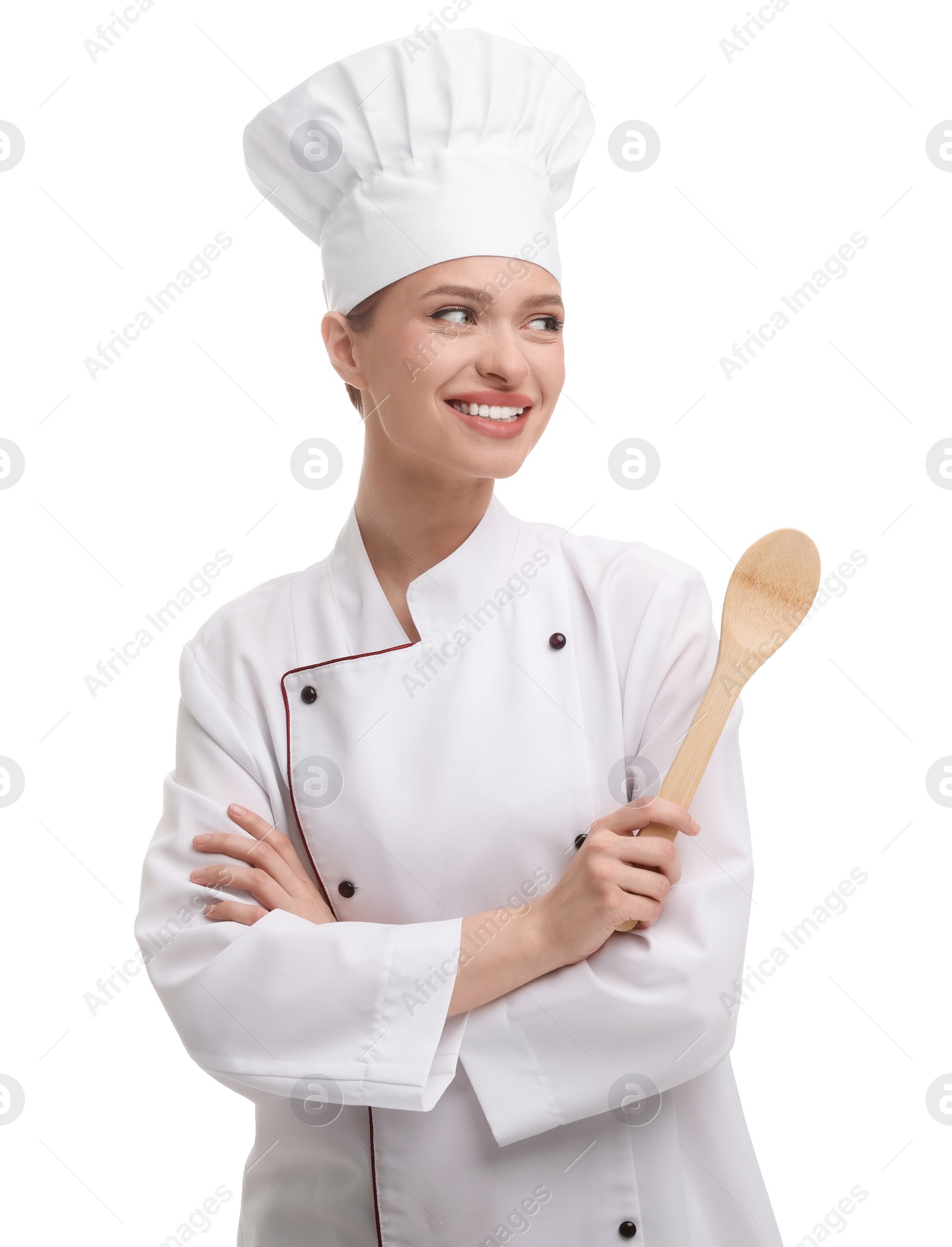 Photo of Happy chef in uniform holding wooden spoon on white background