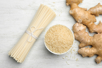 Flat lay composition with rice noodles on white wooden  table